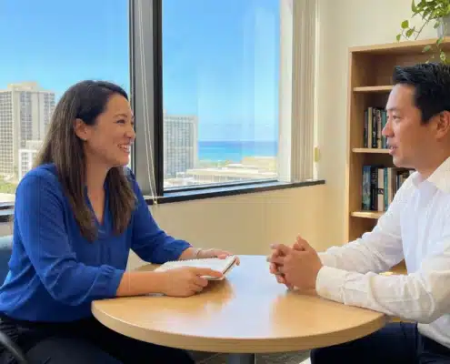 Professional mental health counseling session in Honolulu featuring a therapist and client discussing evidence-based treatment plans.