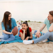Hawaii family spending time on Oahu beach without phones promoting digital well-being and aloha lifestyle.