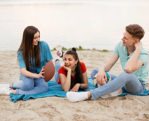 Hawaii family spending time on Oahu beach without phones promoting digital well-being and aloha lifestyle.